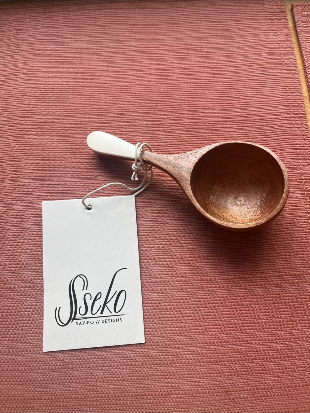 Sseko Pink and Natural Brown Handheld Wooden Scoop